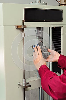 Engineer set up and testing old machine in factory