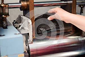 Engineer set up and testing old machine in factory