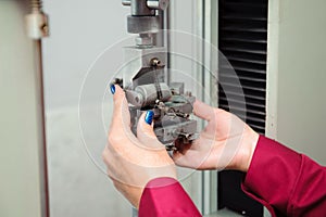 Engineer set up and testing old machine in factory, engineering and industrial concept.