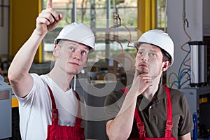 Engineer showing something at production area