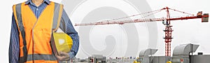 Engineer standing with Industrial construction crane on background. With Clipping path
