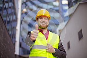 Engineer standing on the street. Cloe up. Thumb up