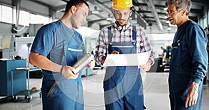 Engineer Teaching Apprentices To Use Computerized cnc metal processing machines