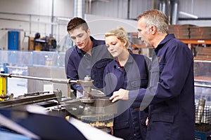 Engineer Teaching Apprentices To Use Tube Bending Machine