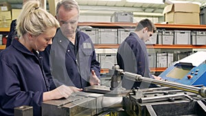 Engineer Teaching Apprentices To Use Tube Bending Machine