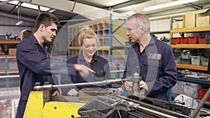 Engineer Teaching Apprentices To Use Tube Bending Machine