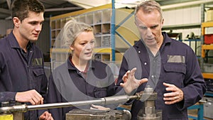 Engineer Teaching Apprentices To Use Tube Bending Machine