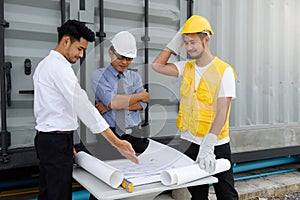 Engineer team look at construction blueprint