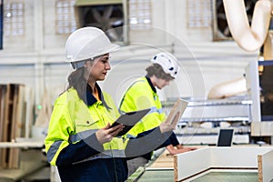 engineer team staff worker working in wooden furniture factory control operate wood cutter machine