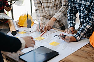 Engineer Teamwork Meeting, Drawing working on blueprint meeting for project working with partner on model building at company