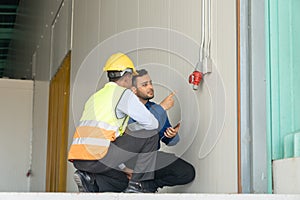 Engineer and technician working together in construction site