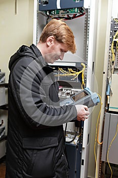 Engineer with telecom analyzer