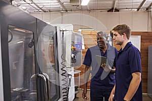 Engineer Training Male Apprentice On CNC Machine