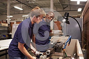 Engineer Training Male Apprentice On Milling Machine