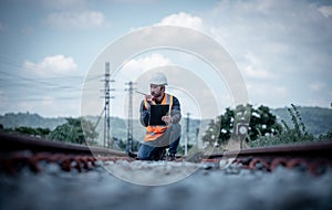 Engineer under discussion inspection and checking construction process railway switch and checking work on railroad station .Engin