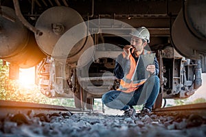 Engineer under discussion inspection and checking construction process railway switch and checking work on railroad station .Engin