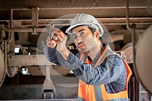 Engineer under discussion inspection and checking construction process railway switch and checking work on railroad station .Engin