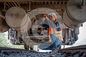 Engineer under discussion inspection and checking construction process railway switch and checking work on railroad station .Engin