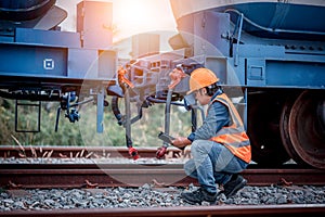 Engineer under discussion inspection and checking construction process railway switch and checking work on railroad station .Engin