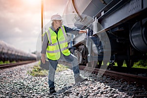 Engineer under discussion inspection and checking construction process railway switch and checking work on railroad station .Engin