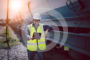 Engineer under discussion inspection and checking construction process railway switch and checking work on railroad station .Engin