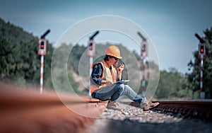 Engineer under discussion inspection and checking construction process railway switch and checking work on railroad station .Engin