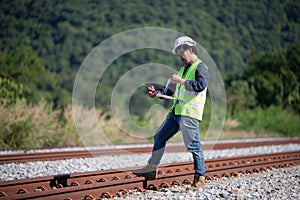 Engineer under discussion inspection and checking construction process railway switch and checking work on railroad station .Engin