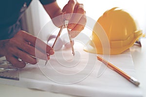 Engineer use architect  working on the table