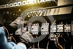 Engineer use meter checking electric at terminal block circuit breaker and cable