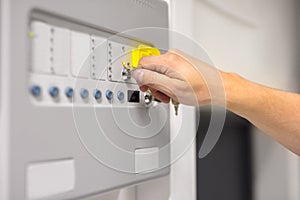 IT Engineer Using Key To Open Fire Panel In Datacenter