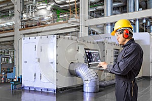 Engineer using laptop computer for maintenance thermal power factory