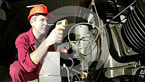 Engineer Using Laser Thermometer Gun