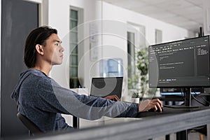 It engineer using programming computer to write html code on terminal window