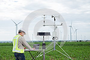 Engineer using tablet computer collect data with meteorological photo