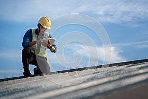 Engineer using tablet to inspect work at job site