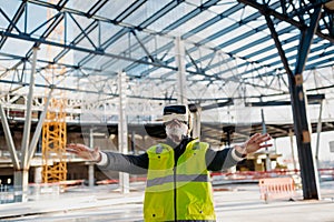Engineer using virtual reality to inspect building progress.