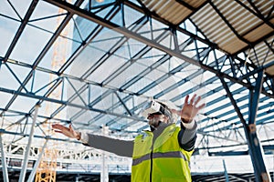 Engineer using virtual reality to inspect building progress.
