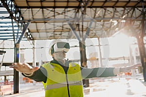 Engineer using virtual reality to inspect building progress.