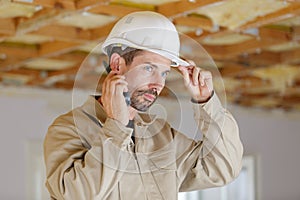 engineer using walkie talkie for workers security