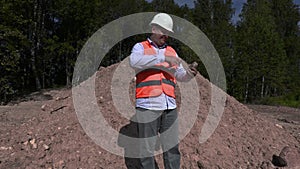Engineer verify the quality of gravel