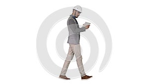 Engineer walking and working on digital tablet on white background.
