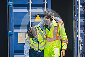 Engineer wear PPE urgently assisted the male technique inside container as Chemical spill in the container shipping industry