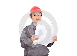 An engineer wearing a hard hat is looking at the drawings