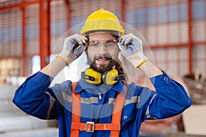 Engineer wearing safety eye glasses before work