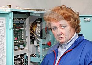 Engineer woman in machine room (elevator) .
