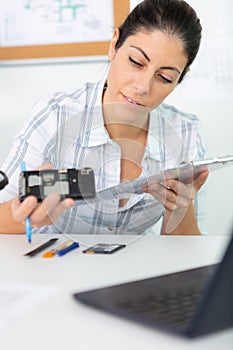 engineer woman repairing computer part