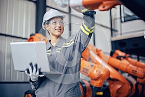 Engineer woman team worker work in Machine Robotic modern Automation Industry. Mechanic staff employee in metal factory