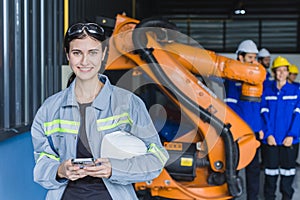 Engineer woman team worker work in Machine Robotic modern Automation Industry. Mechanic staff employee in metal factory