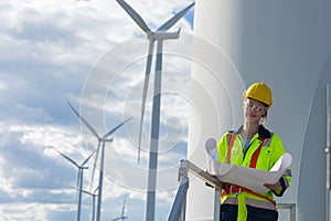 Engineer woman technician portrait working service wind turbine sustainable eco power energy genrator happy smile