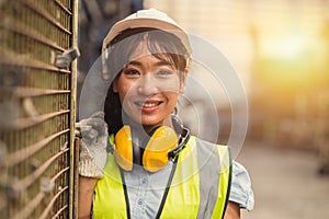 Engineer woman worker, Asian working women happy smiling in hevy industry machinery factory